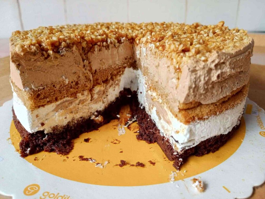 Sliced portion of Coffee Layered Crunch showing the insides of the cut cake.